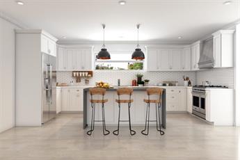 White shaker kitchen with a gray island and pendant lights