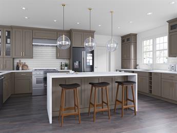 Large gray kitchen with a long waterfall island and bar seating